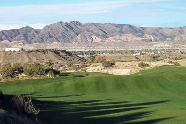 fairways with scenic mountains in the background